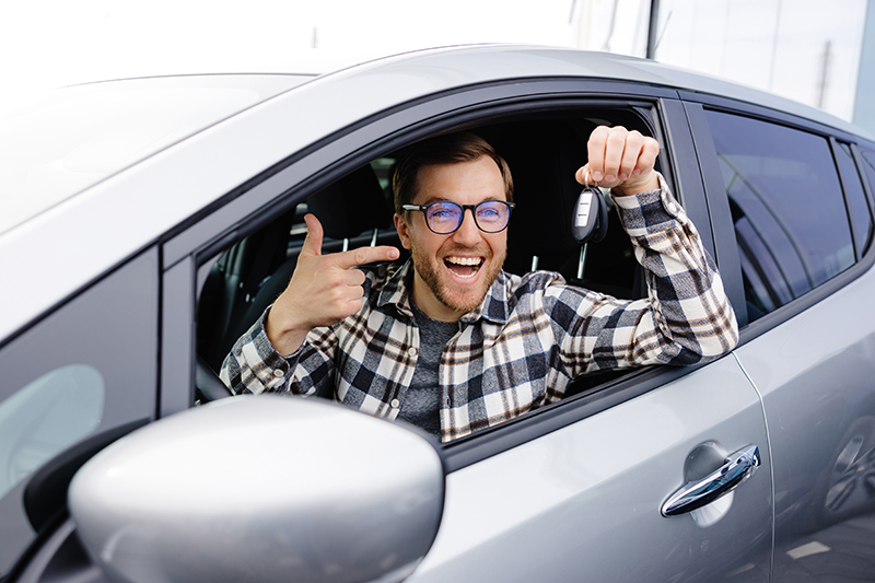 Happy man with car keys
